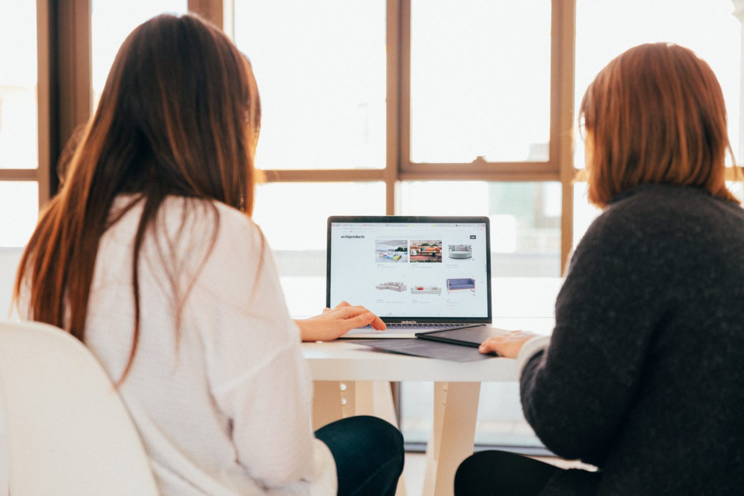 pair programmers looking at screen together